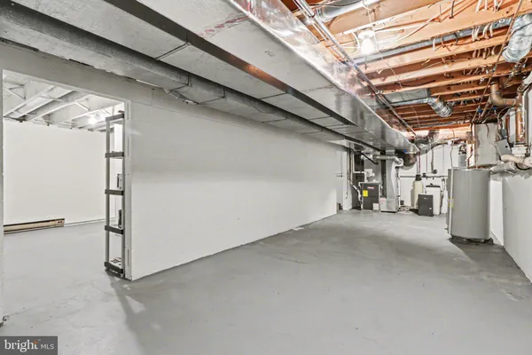 a bedroom with furniture and window