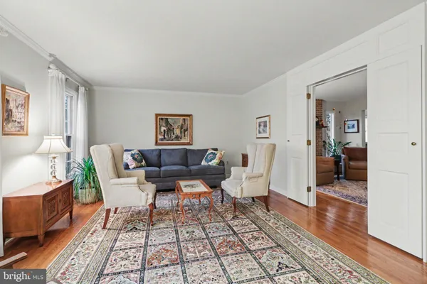 a living room with furniture and a rug
