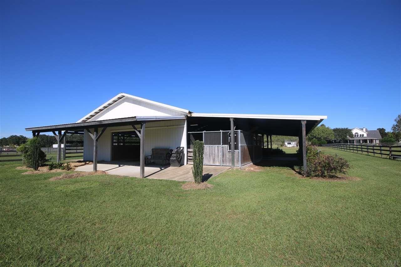 5559 Allie Rae Street Milton, FL 32570 - Photo 47 of 50 equipment. House in the distance to the right.