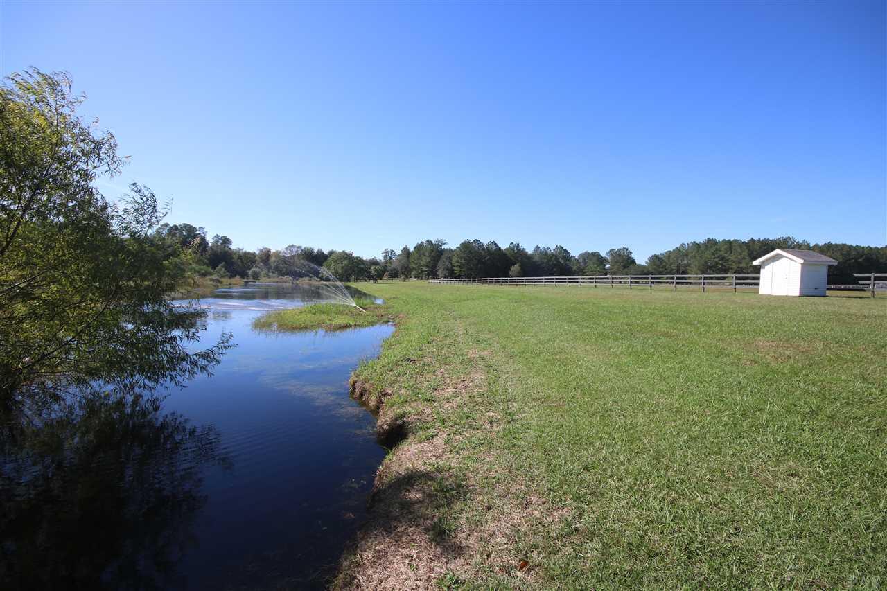5559 Allie Rae Street Milton, FL 32570 - Photo 48 of 50 Pond shared with back neighbors.