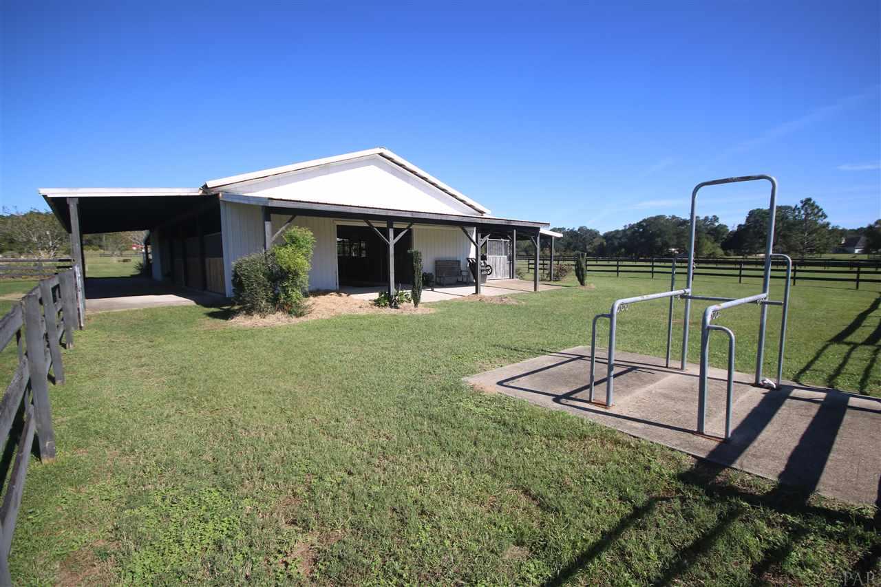 5559 Allie Rae Street Milton, FL 32570 - Photo 5 of 50 barn. 4 stand up horse feeders.