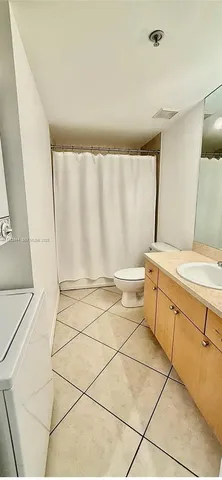a bathroom with a sink a vanity and a shower