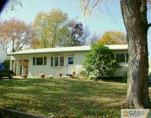19 Villanova Road Old Bridge, NJ 08859 - Photo 1 of 2 a front view of a house with garden