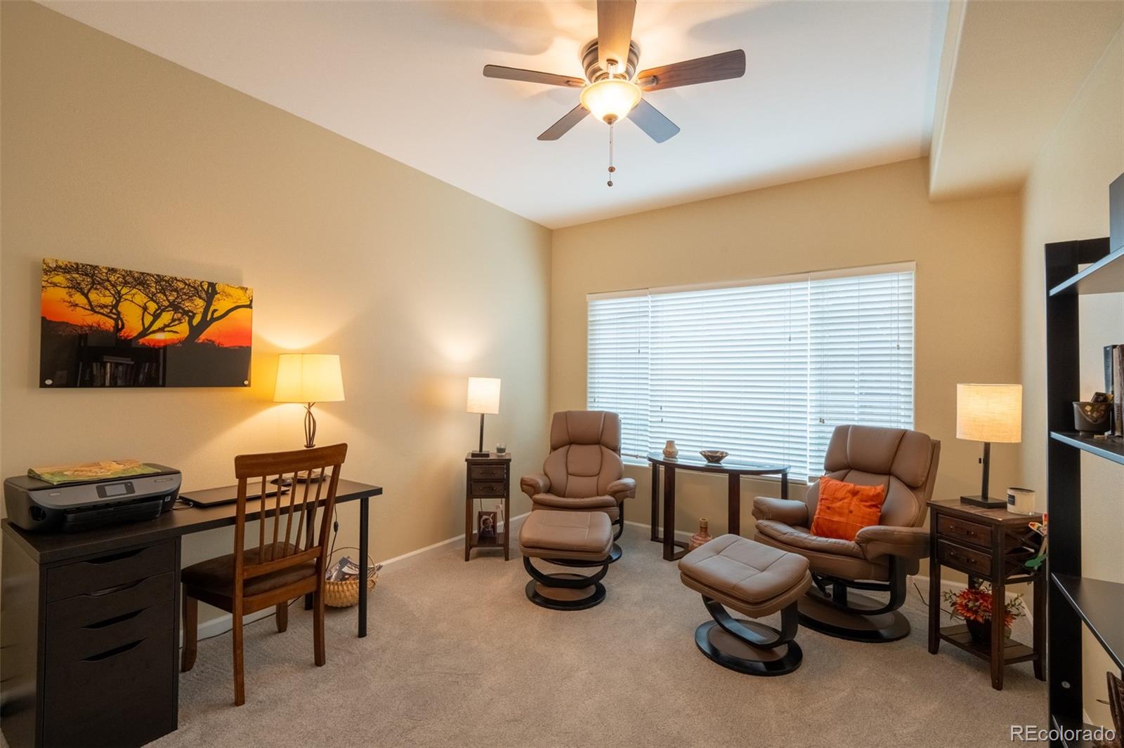 8495 Pebble Creek Way, Unit 102 Highlands Ranch, CO 80126 - Photo 19 of 22 a living room with furniture