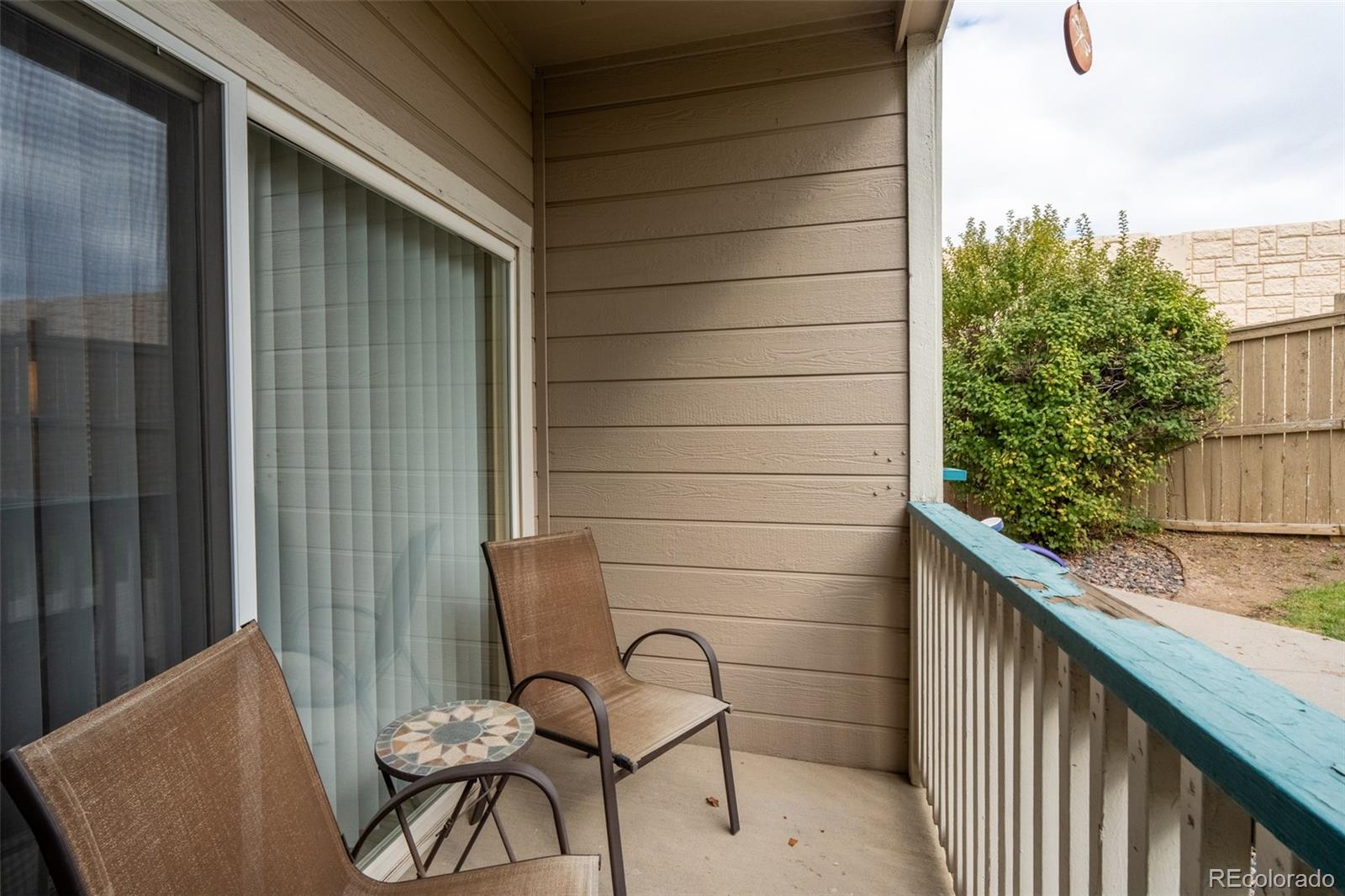 8495 Pebble Creek Way, Unit 102 Highlands Ranch, CO 80126 - Photo 21 of 22 a view of a balcony with furniture
