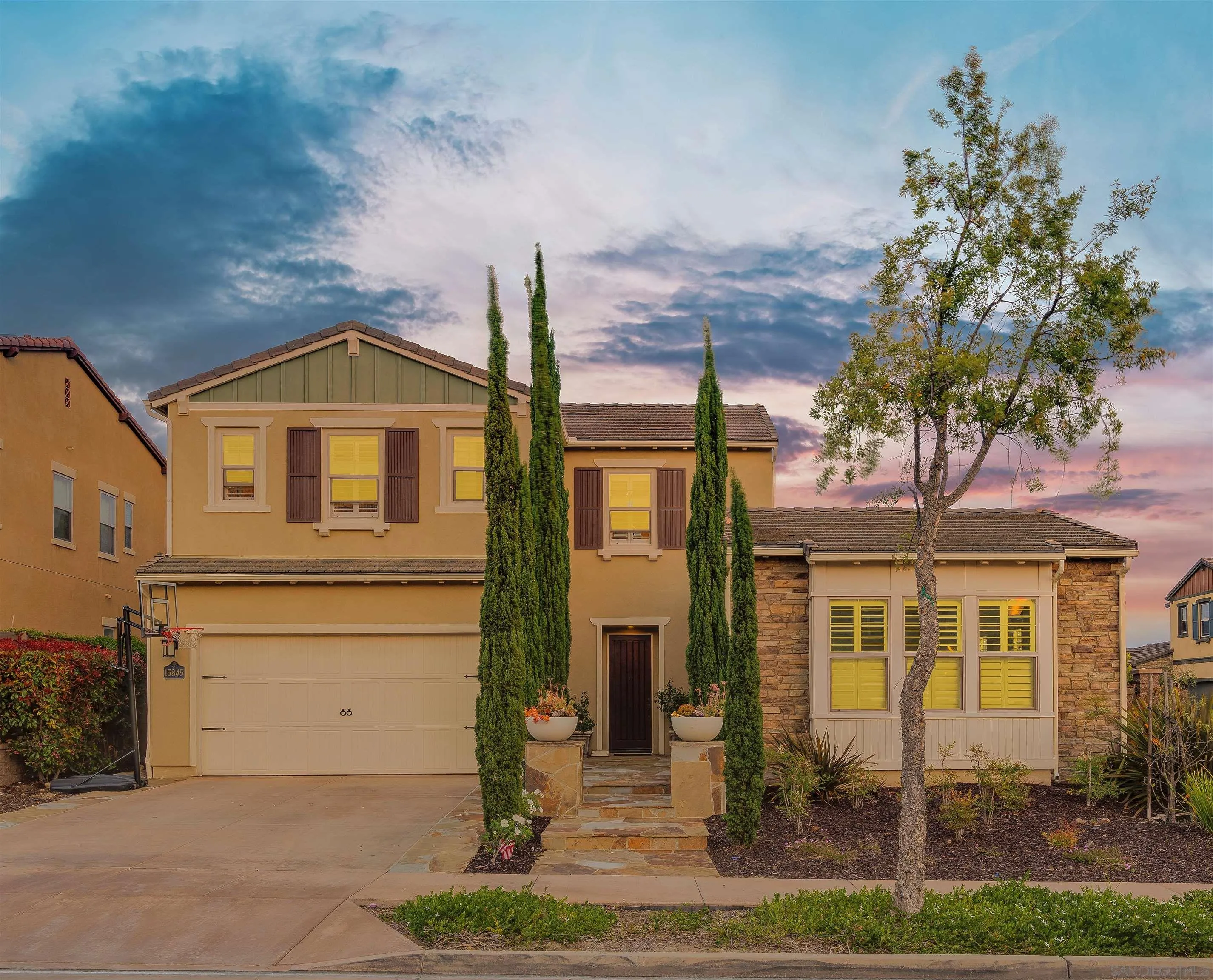 a front view of a house with garden