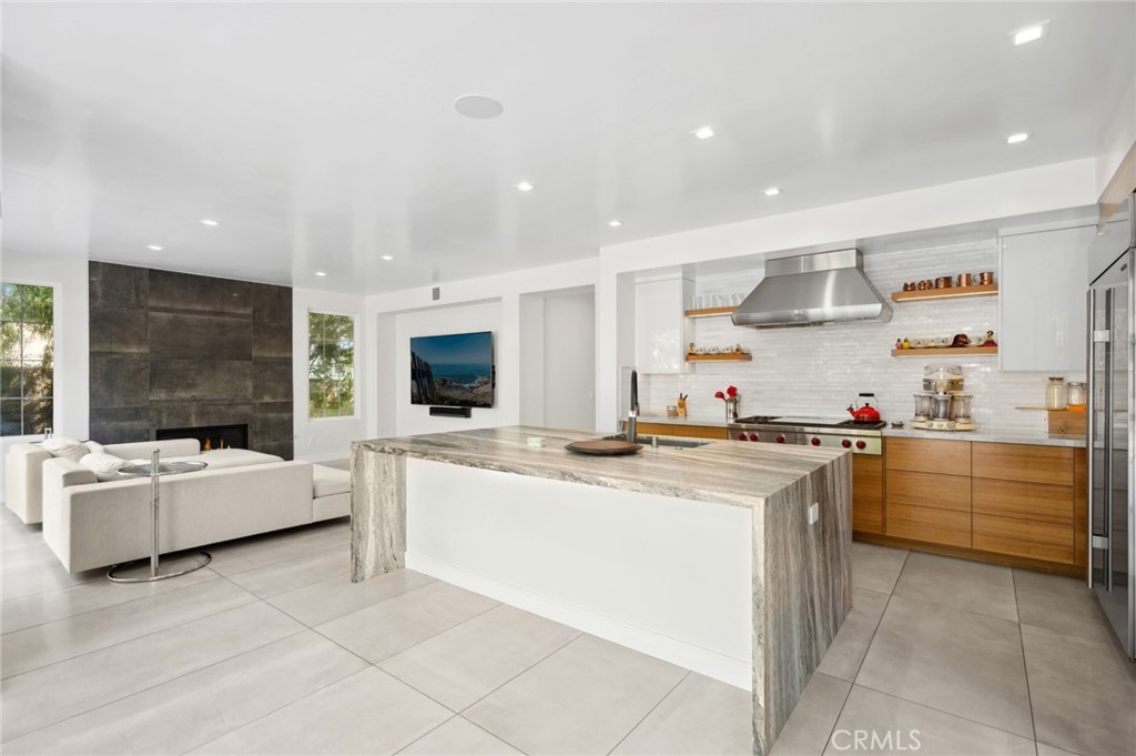 3 Bridgeport Road Newport Coast, CA 92657 - Photo 9 of 25 a kitchen with stainless steel appliances kitchen island granite countertop a sink and cabinets