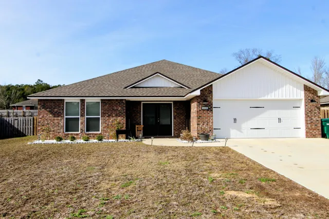 a front view of a house with a outdoor space