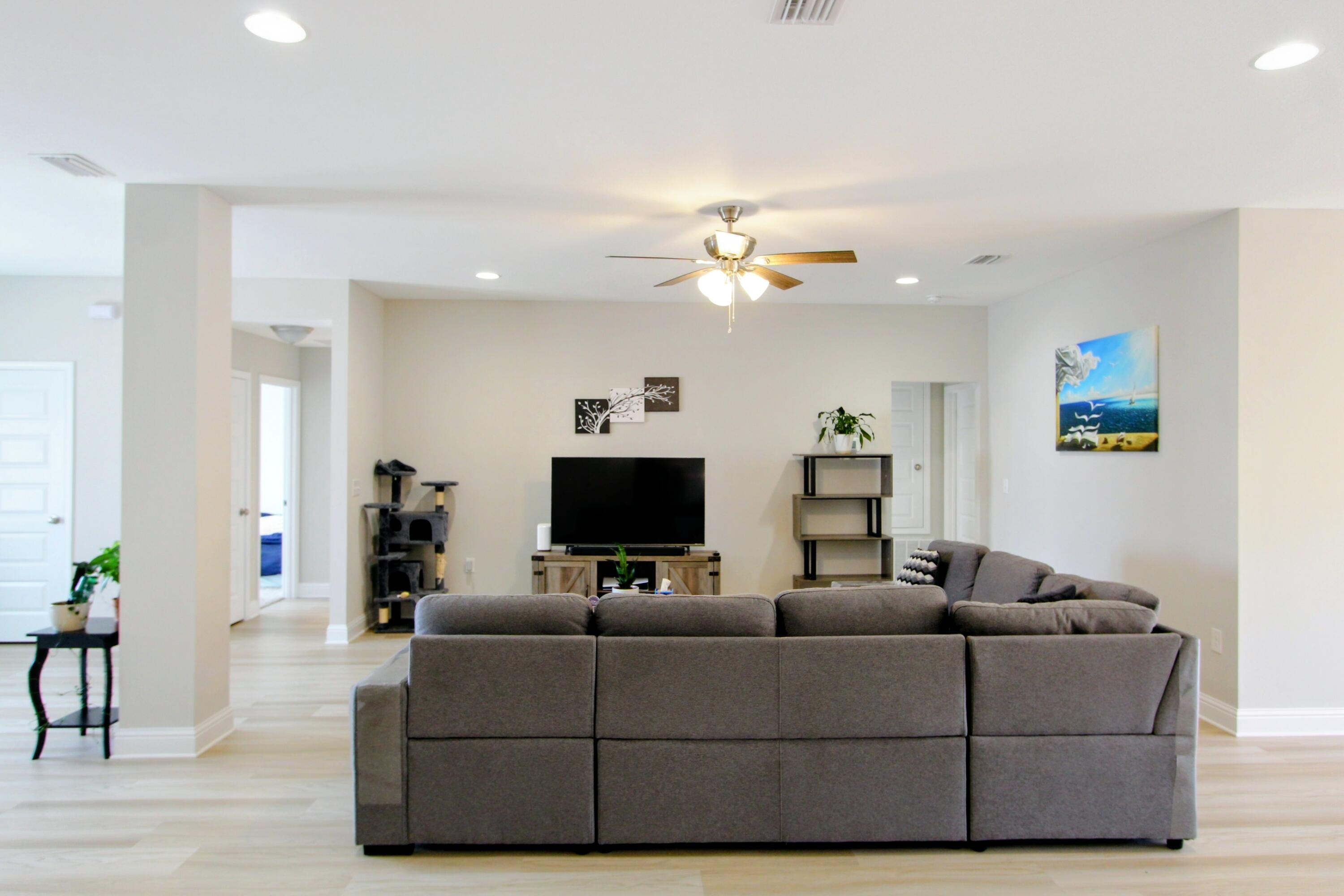 5438 Lee Farm Boulevard Crestview, FL 32536 - Photo 13 of 50 a living room with furniture and a flat screen tv
