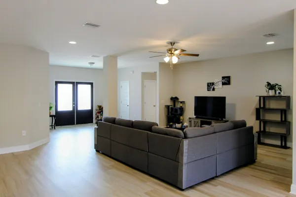 a living room with furniture and a flat screen tv
