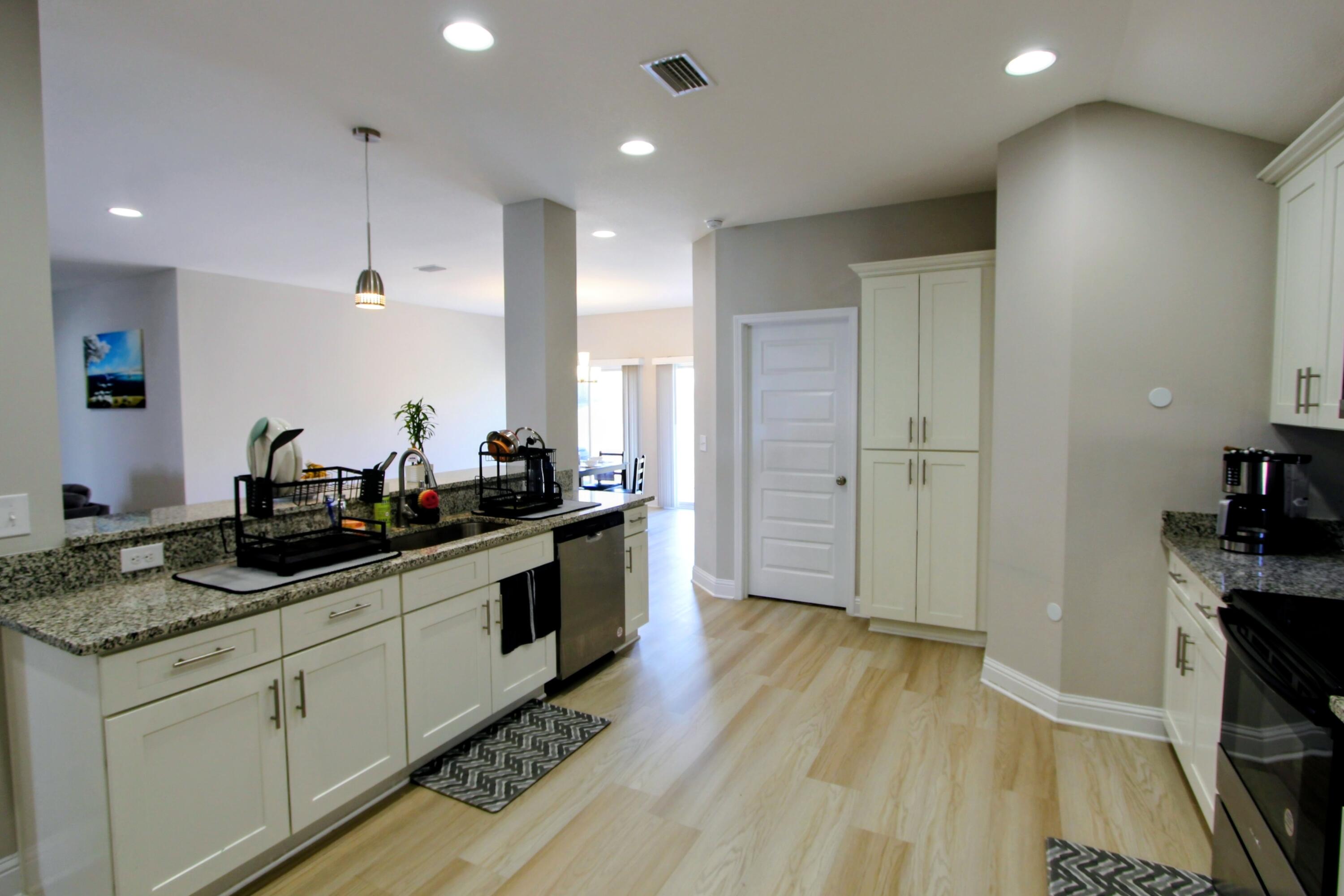 5438 Lee Farm Boulevard Crestview, FL 32536 - Photo 20 of 50 a kitchen with a sink and wooden floor