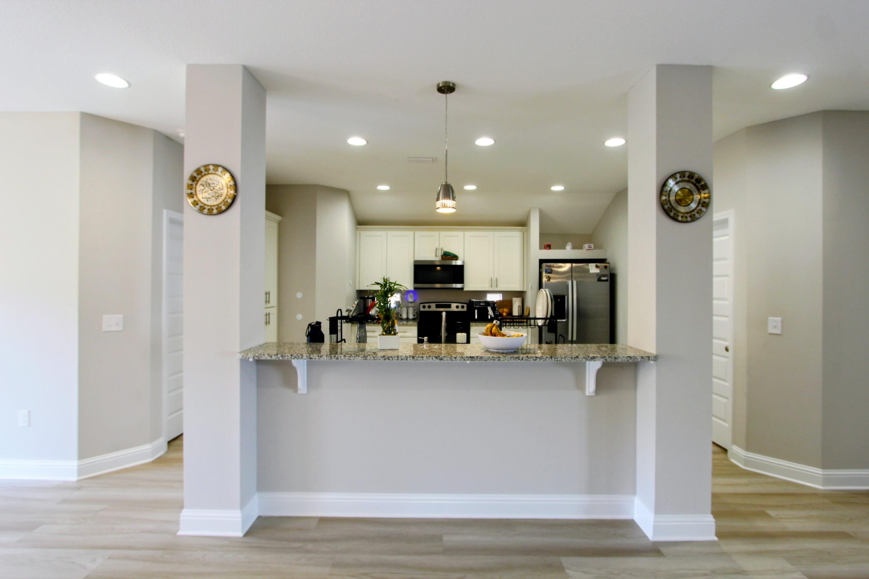 5438 Lee Farm Boulevard Crestview, FL 32536 - Photo 26 of 50 a view of living room with furniture and kitchen view
