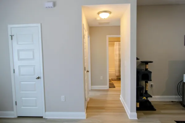 a view of a bathroom from a hallway