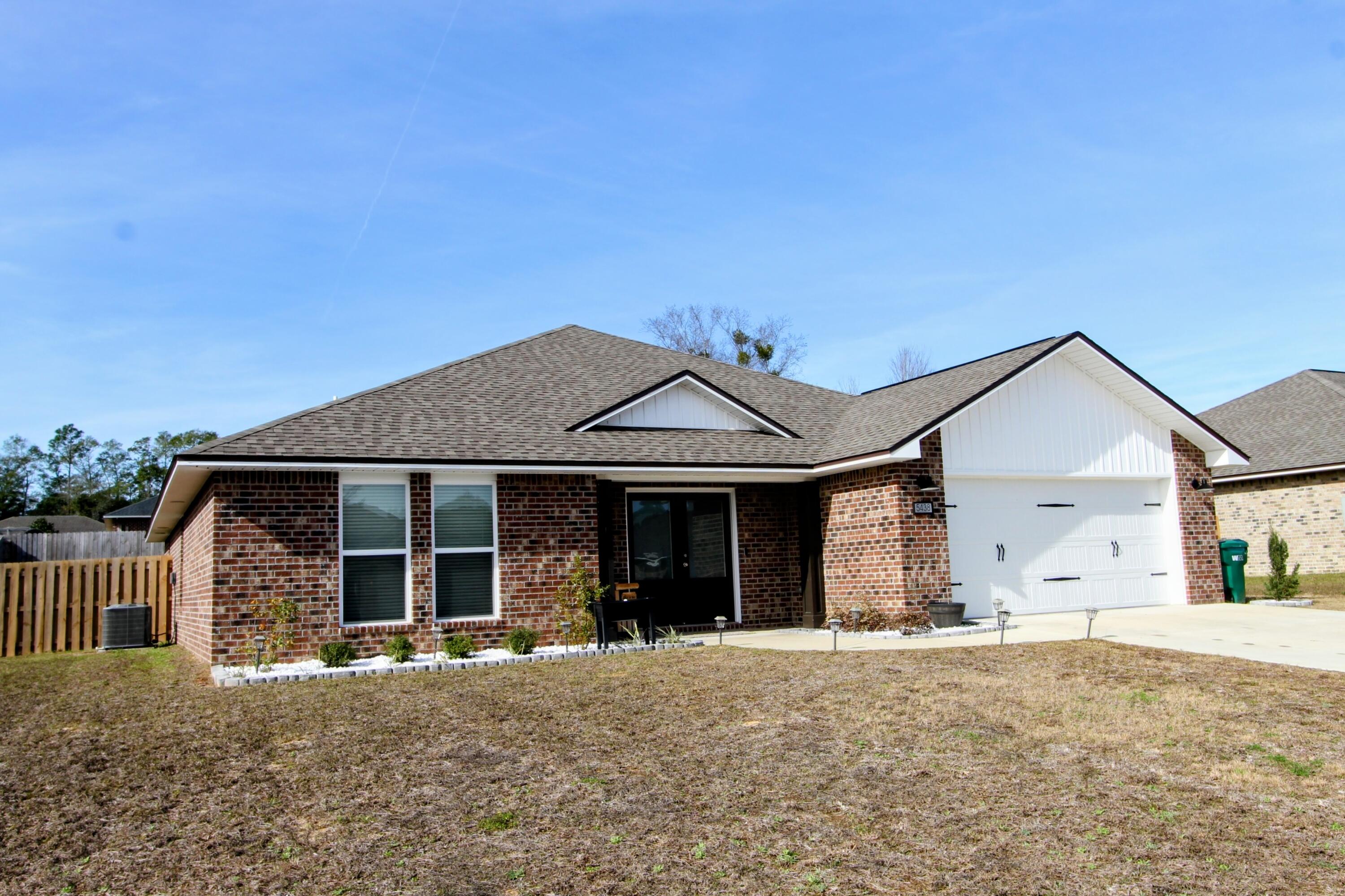 5438 Lee Farm Boulevard Crestview, FL 32536 - Photo 3 of 50 front view of a house with a yard