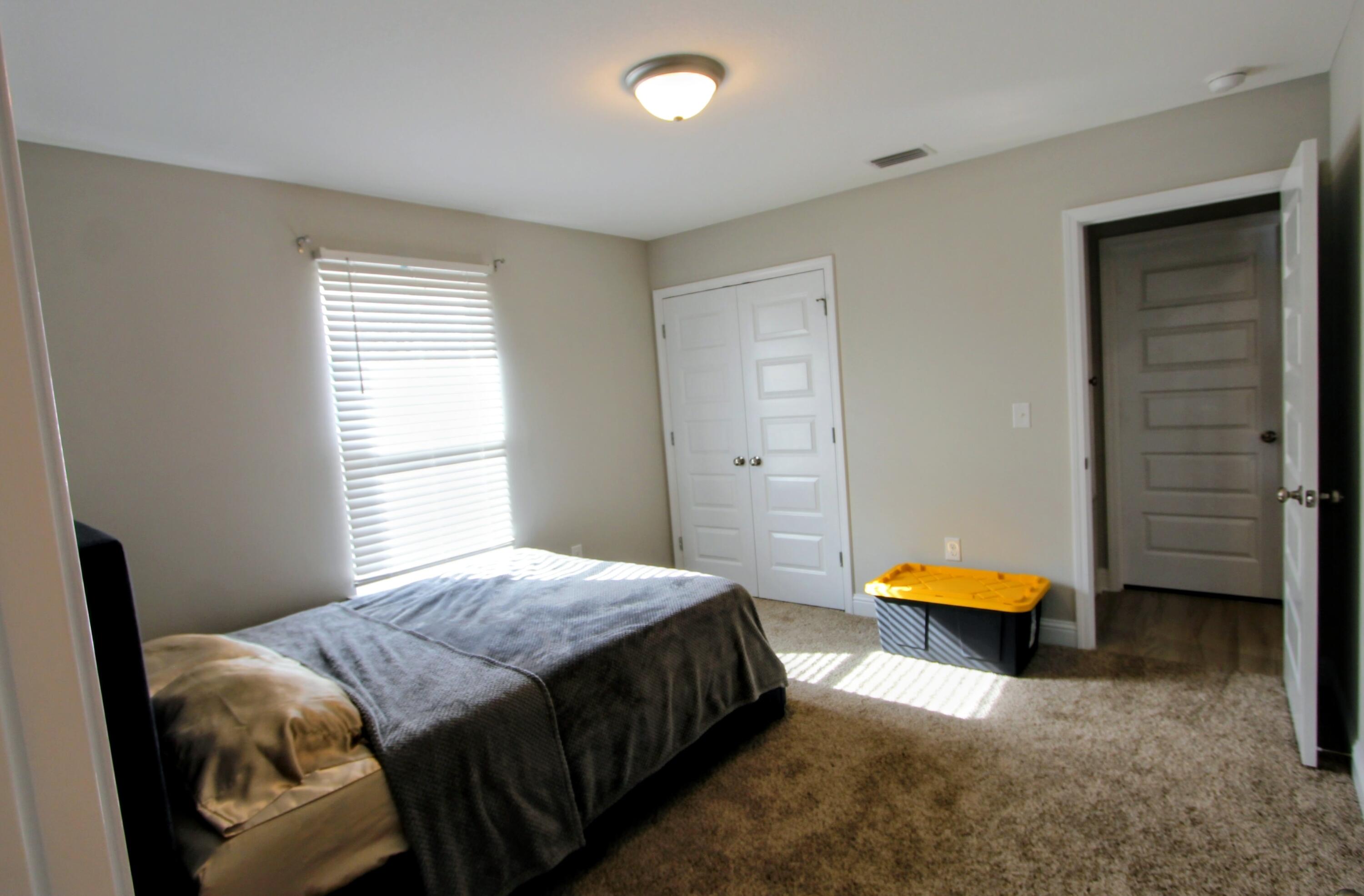 5438 Lee Farm Boulevard Crestview, FL 32536 - Photo 34 of 50 a bedroom with a bed and a window