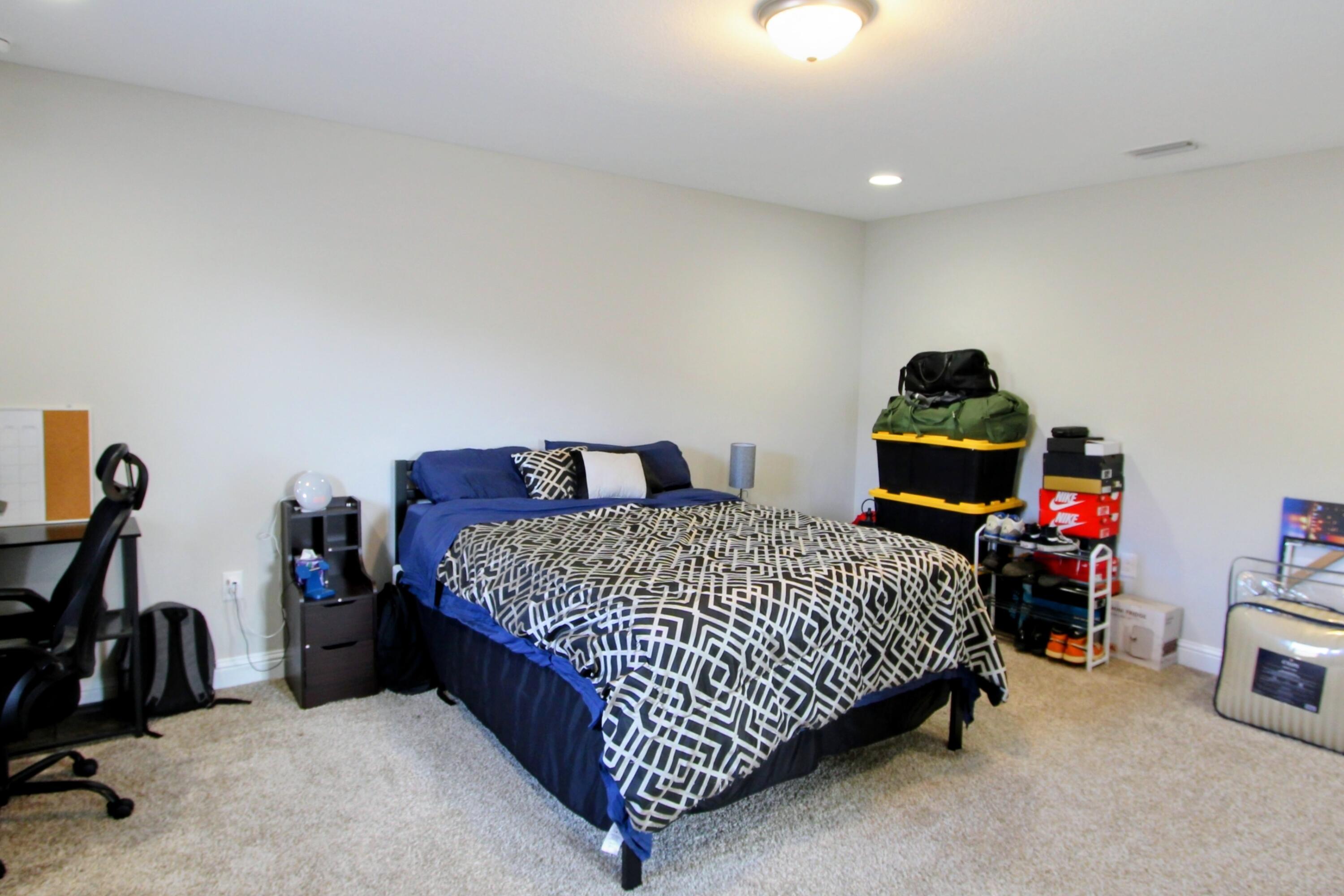 5438 Lee Farm Boulevard Crestview, FL 32536 - Photo 37 of 50 a bedroom with bed and a closet