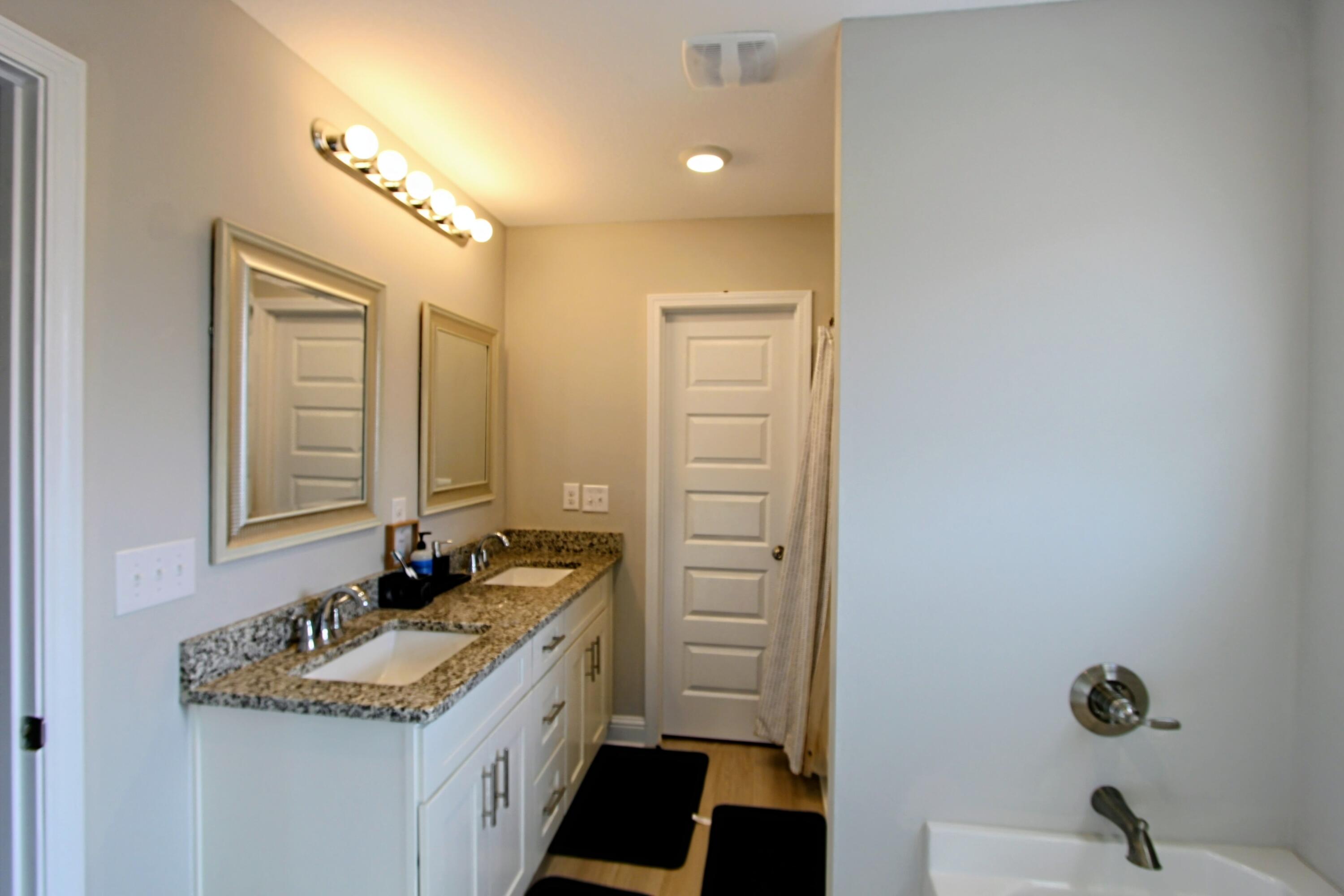 5438 Lee Farm Boulevard Crestview, FL 32536 - Photo 40 of 50 a bathroom with a sink and a mirror