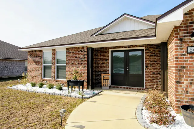 a front view of a house with a outdoor space