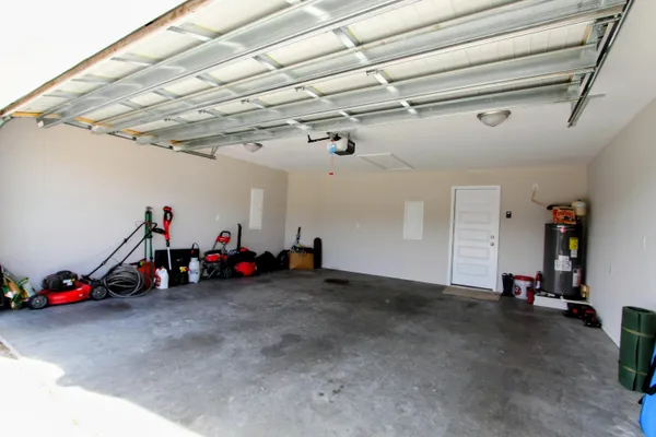 a view of a yard with wooden fence