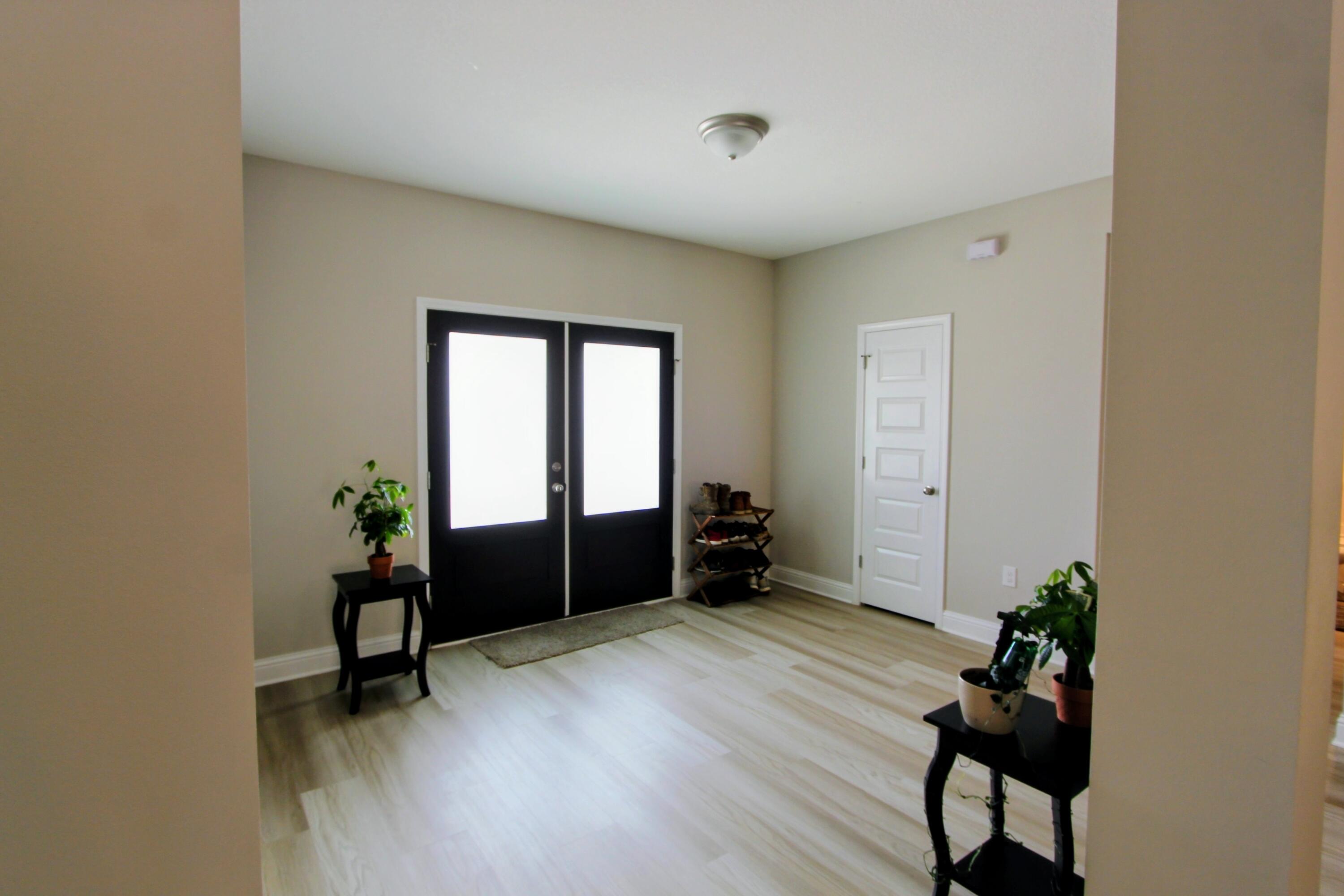 5438 Lee Farm Boulevard Crestview, FL 32536 - Photo 9 of 50 a room with furniture and a potted plant