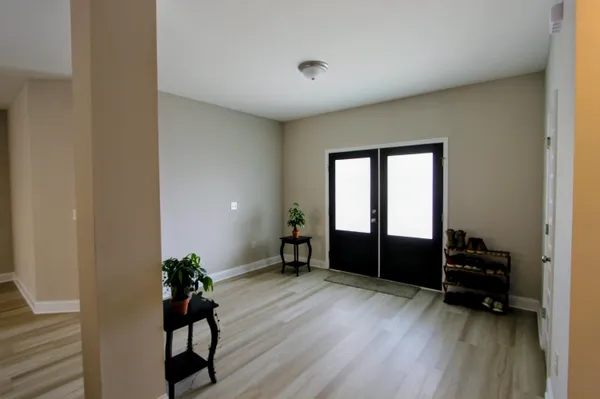 a view of workspace with wooden floor and furniture