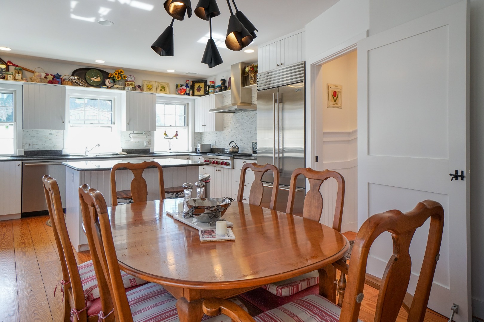36 Cliff Road Nantucket, MA 02554 - Photo 9 of 15 a view of a dining room with furniture and chandelier