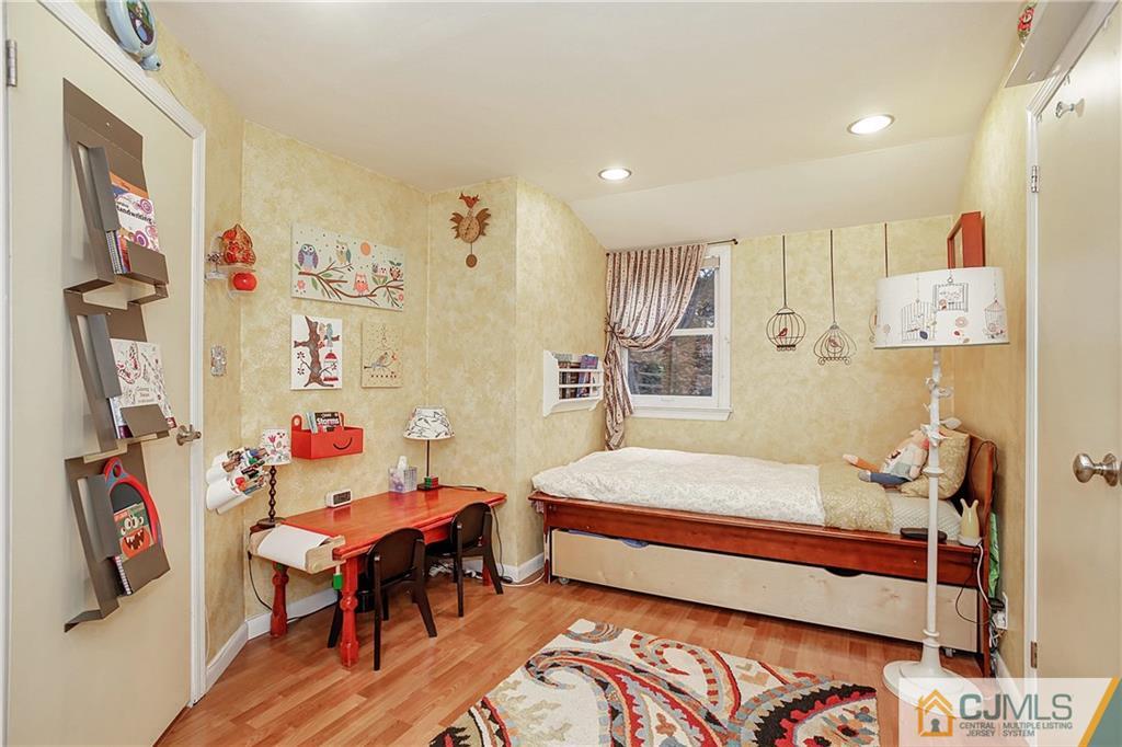 921 Raritan Road Scotch Plains, NJ 07076 - Photo 14 of 25 a bedroom with furniture and a bed