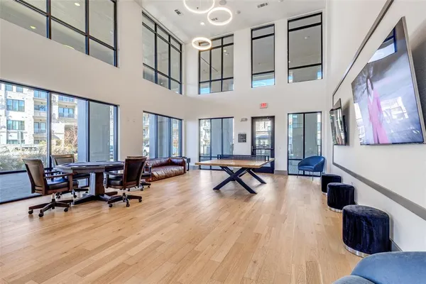 a living room filled with furniture hardwood floor and a table