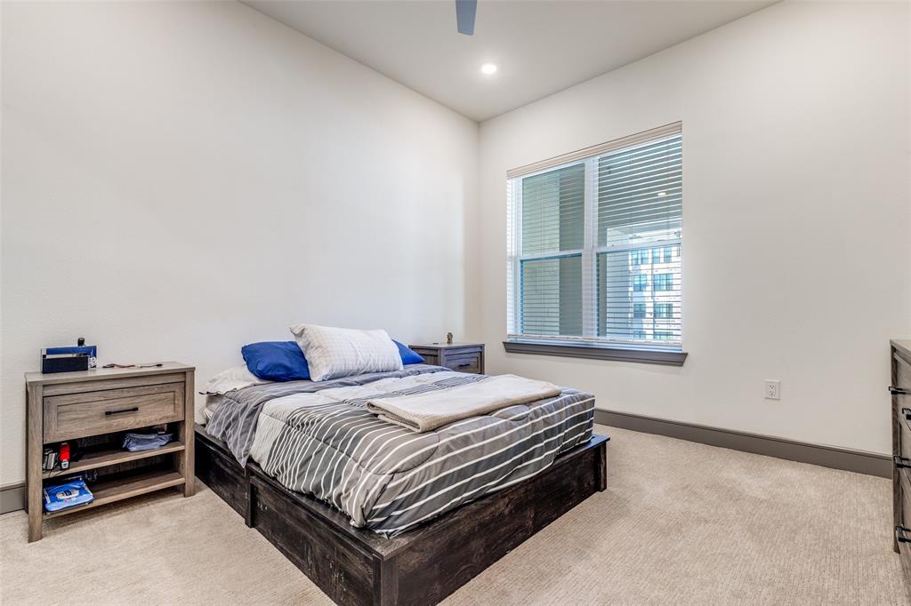 2700 Old Denton Road, Unit 2203 Carrollton, TX 75007 - Photo 8 of 13 a bedroom with a bed and windows