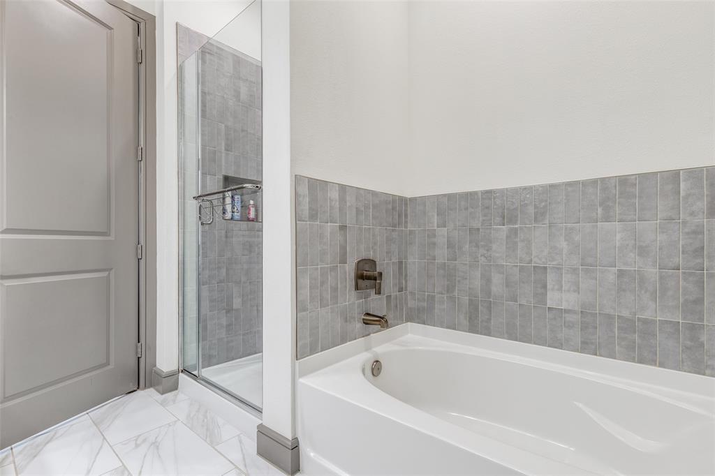 2700 Old Denton Road, Unit 2203 Carrollton, TX 75007 - Photo 10 of 13 a bathroom with a bathtub and shower
