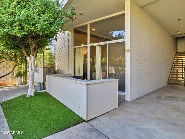 a view of backyard with a garden and trees