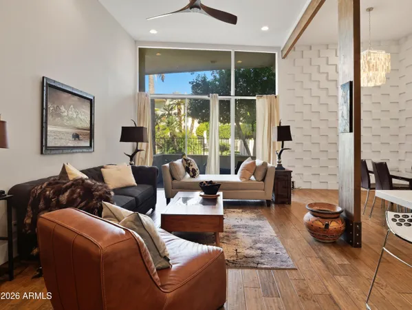a living room with furniture and a large window