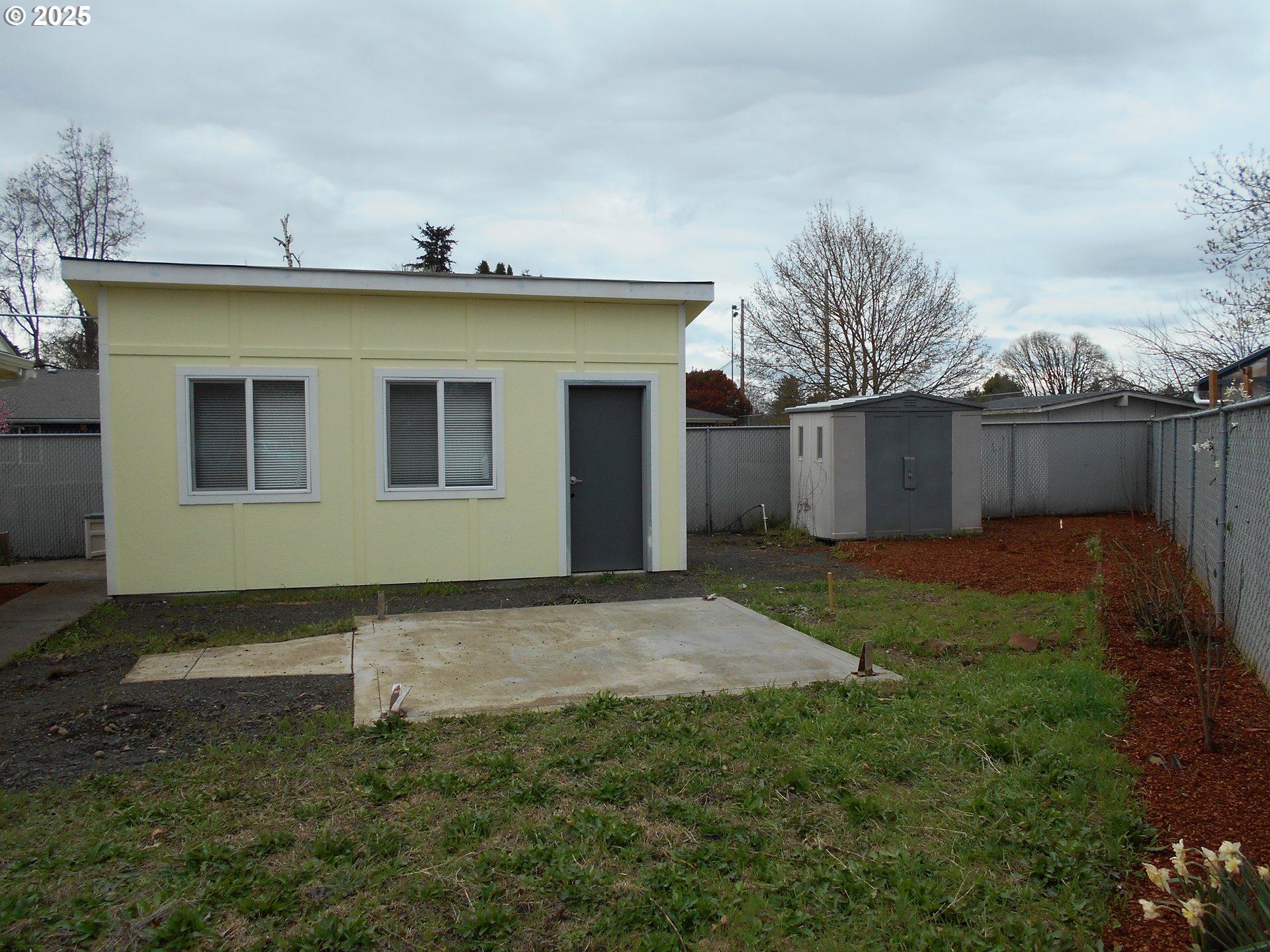 4565 Souza Street Eugene, OR 97402 - Photo 6 of 43 a view of a house with a yard and plants