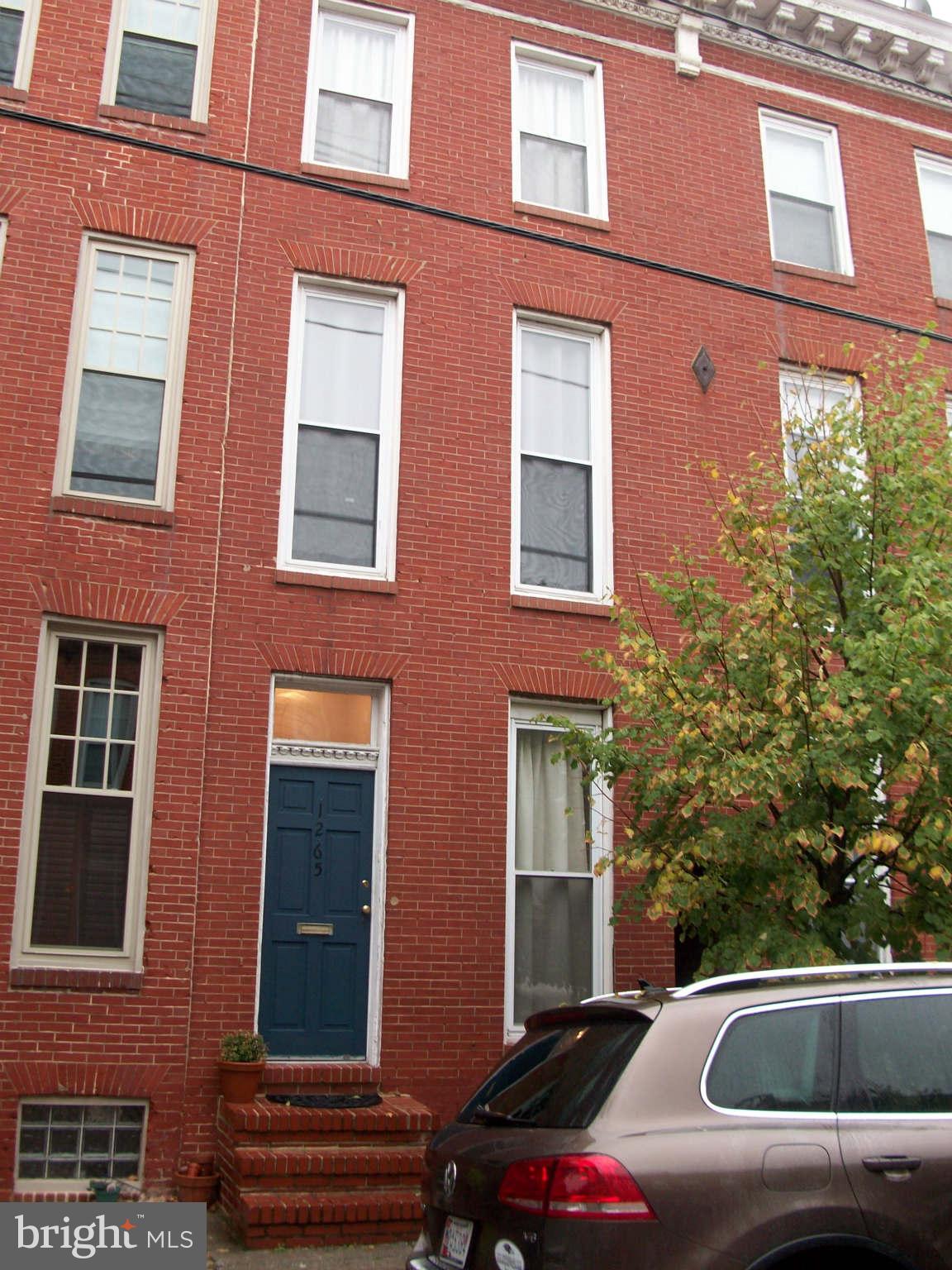 1265 Riverside Avenue Baltimore, MD 21230 - Photo 1 of 12 a view of a brick building with many windows