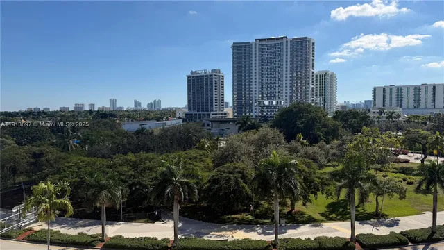 a view of a city with tall buildings