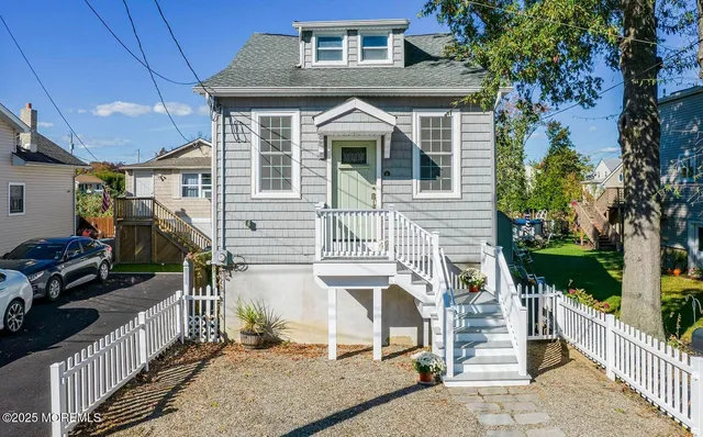 a front view of a house with a porch