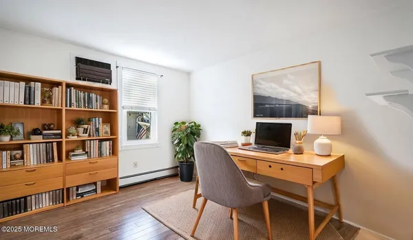 a workspace with furniture and a book shelf