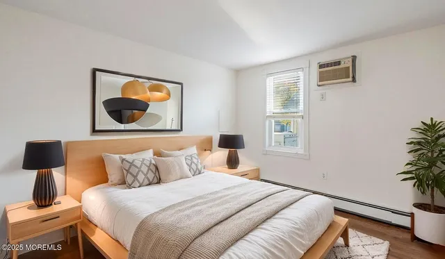 a bedroom with a bed and a potted plant