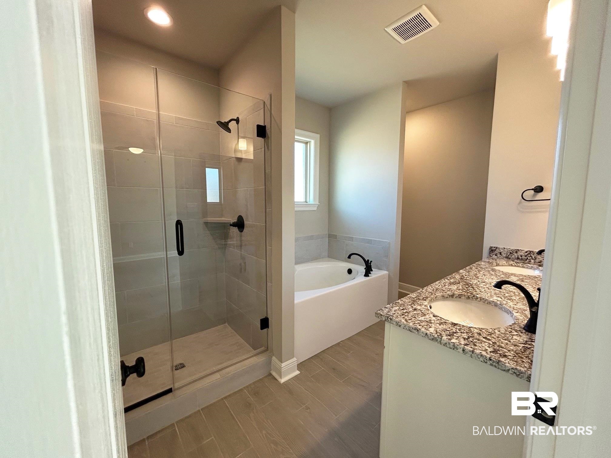 881 Sumter Loop Foley, AL 36535 - Photo 8 of 19 Bathroom with vanity and separate shower and tub