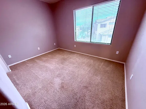 a bathroom with a tub and a window