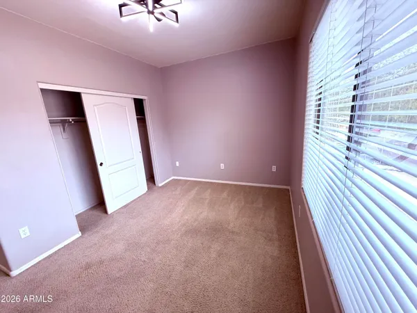 a bathroom with a double vanity sink and mirror