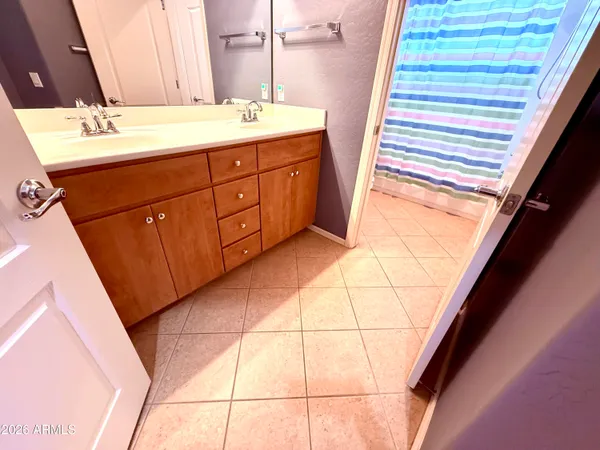 a view of a balcony with a floor to ceiling window and wooden fence