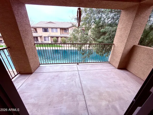 a view of swimming pool with outdoor seating