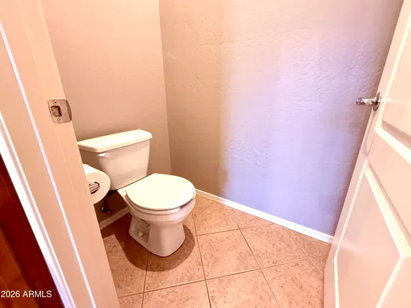 a view of a hallway with furniture and front door