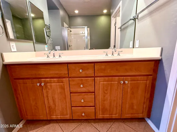 a bathroom with a bathtub sink and mirror