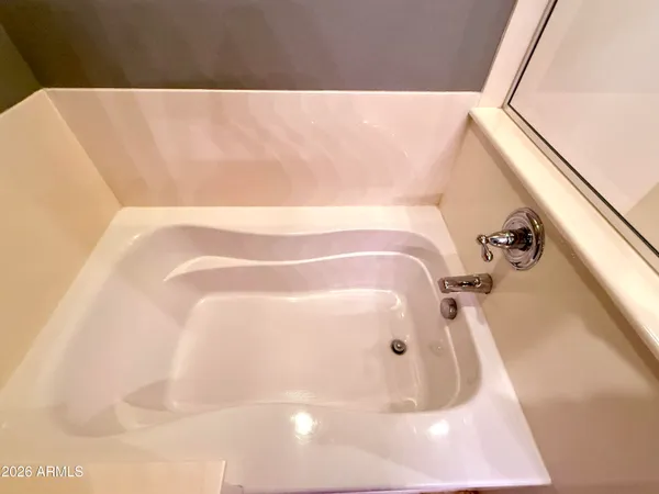 a view of a house with a small yard and plants