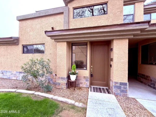 a view of a swimming pool with outdoor seating