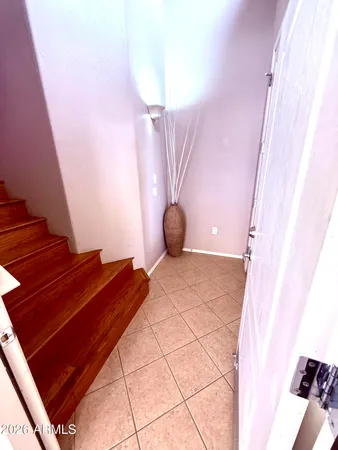 a bedroom with a bed and a mirror