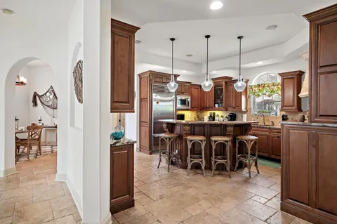 a vase of flowers sitting on a table next to a window