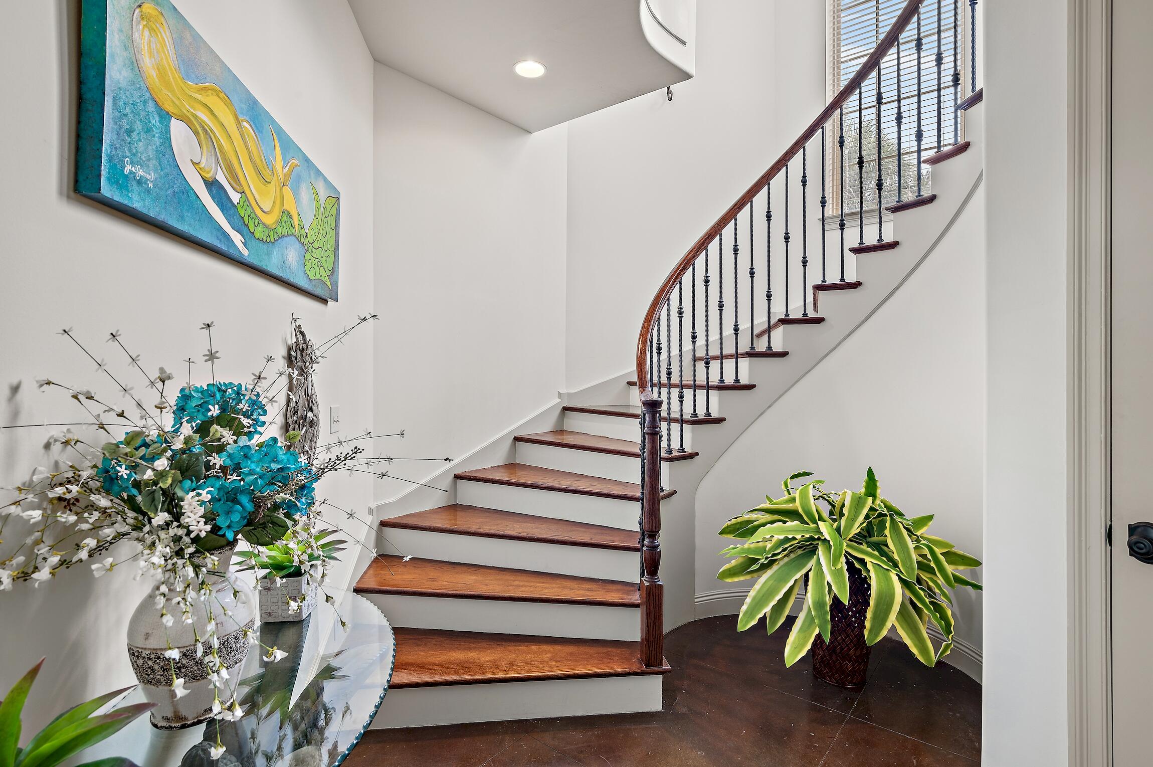 215 Rue St Tropez Miramar Beach, FL 32550 - Photo 15 of 46 a vase of flowers sitting on a table next to a window